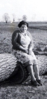 Apron on Woman sitting on a log